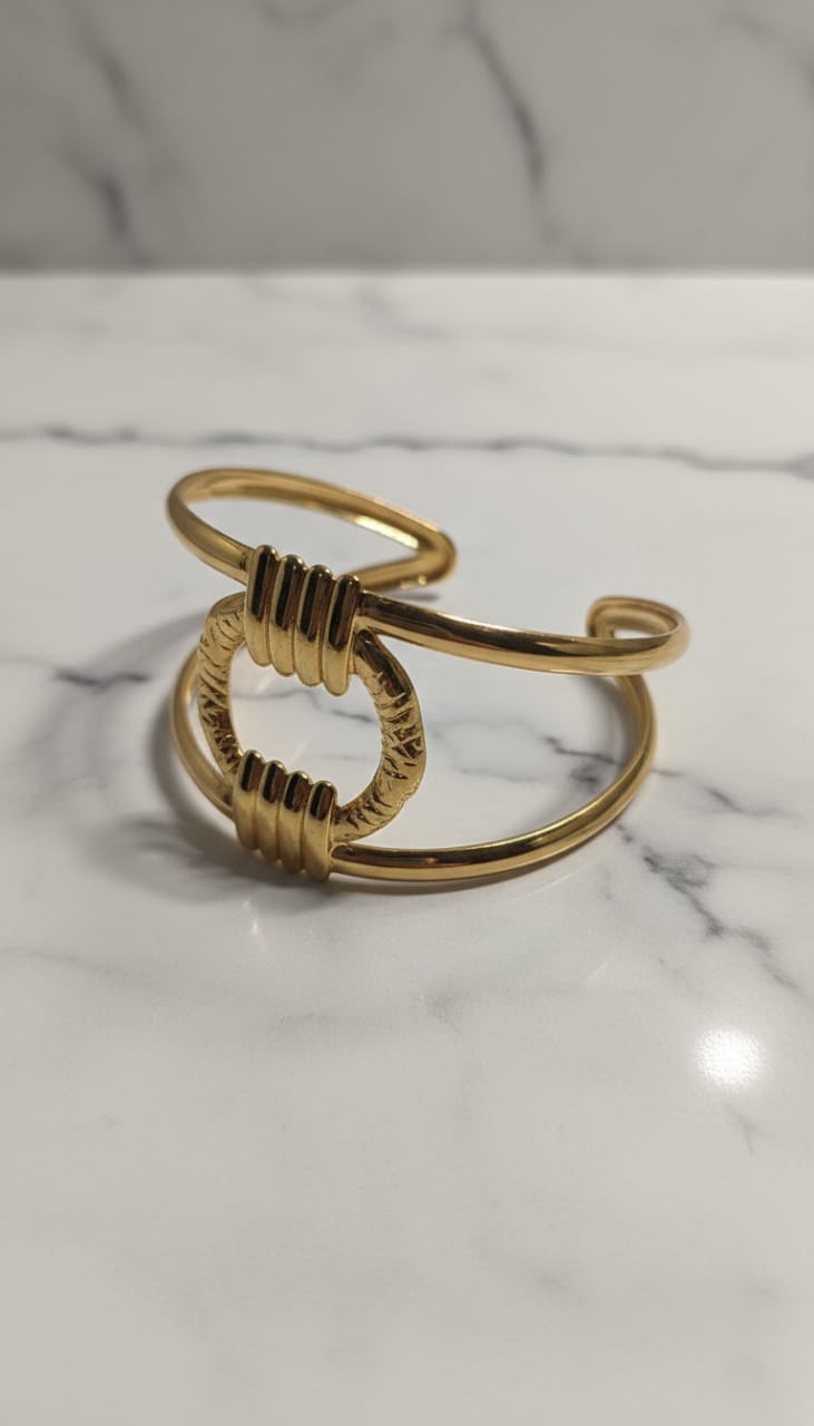 Elegant Gold-Tone Open Cuff Bracelet with Textured Circular Center Design
