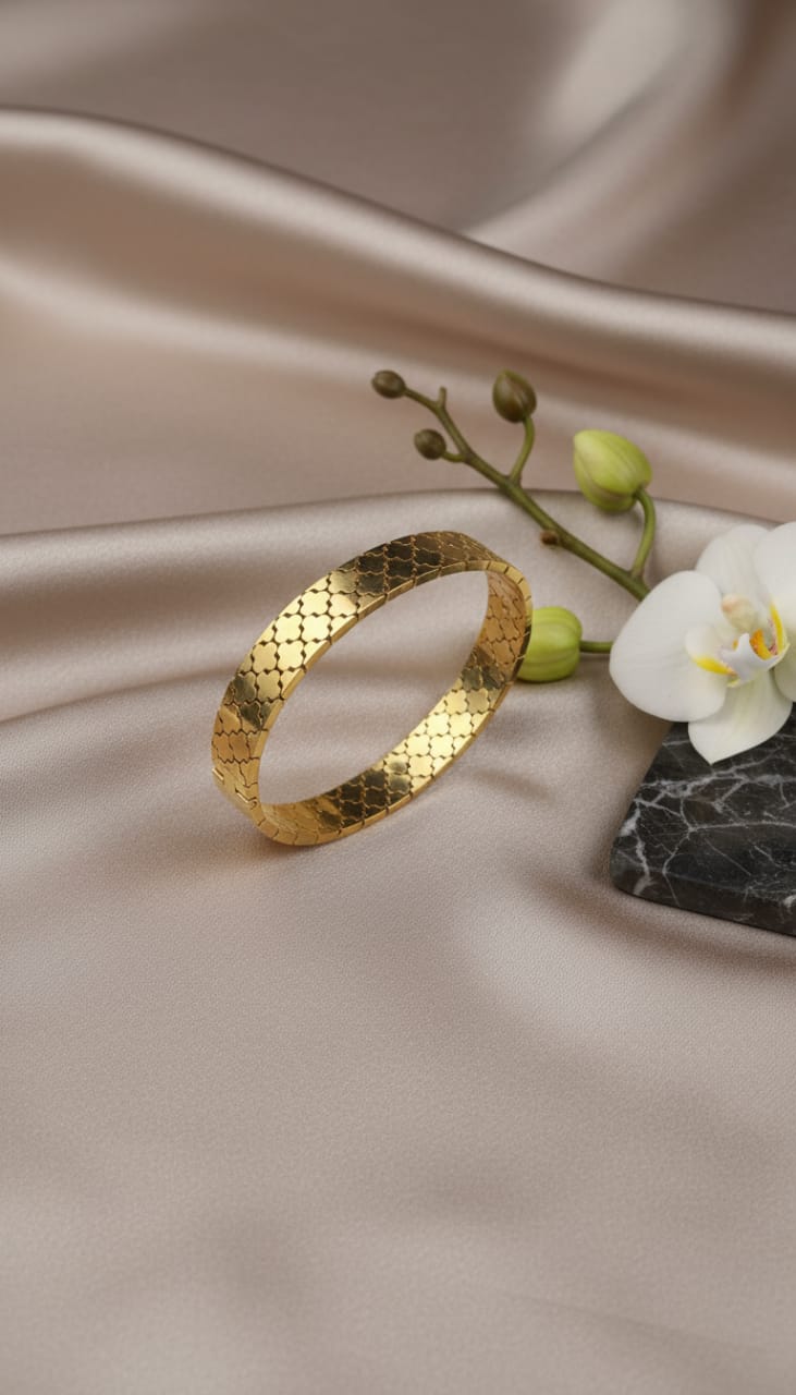 Elegant Gold Cuff with Intricate Design